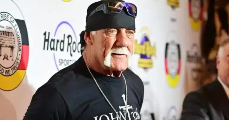 Hulk Hogan in iconic yellow outfit raising hand in WWE ring – Hulk Hogan death 2025 tribute image showing his legacy as a Real American and wrestling icon