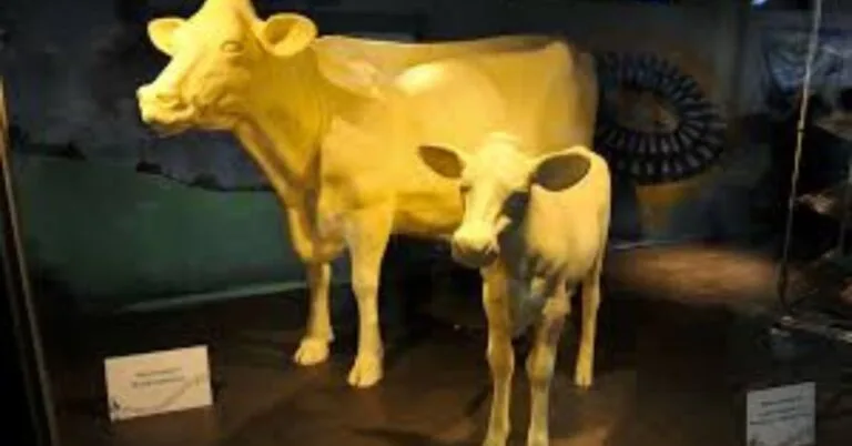 Families enjoying the butter cow sculpture and livestock shows at the Ohio State Fair 2025