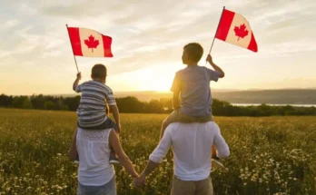 A family enjoying a sunset in Canada, holding Canadian flags, representing affordable universities and global scholarships for international and Pakistani students in 2025.